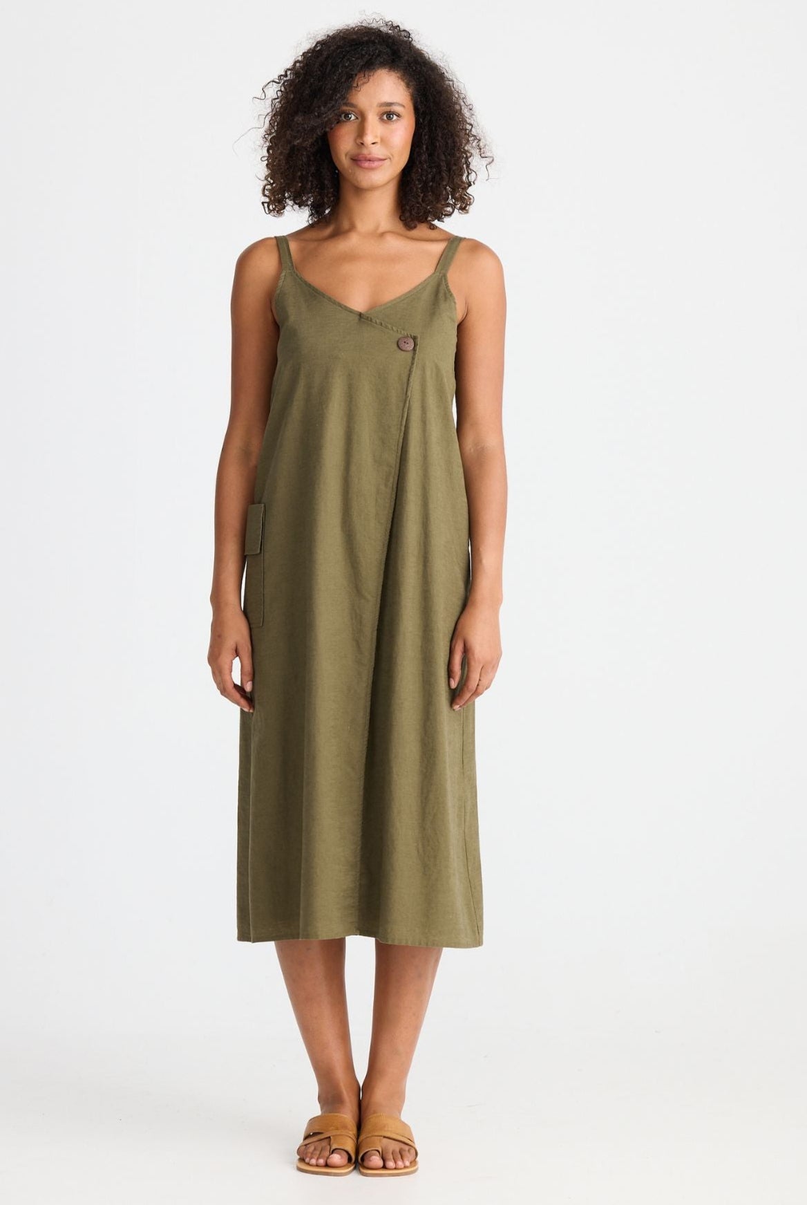 Woman wearing a green dress on a white background