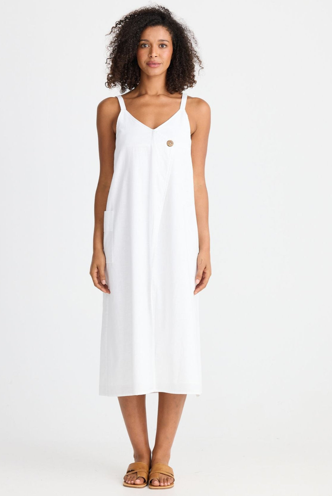 Woman wearing a white dress on a white background