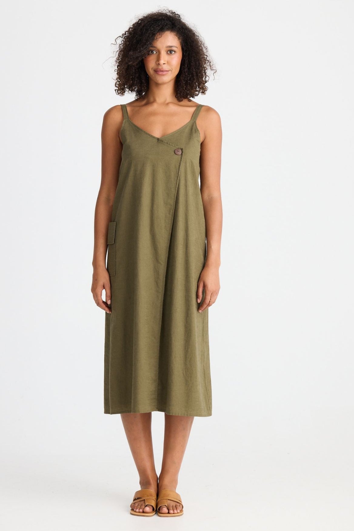 Woman wearing a green dress on a white background